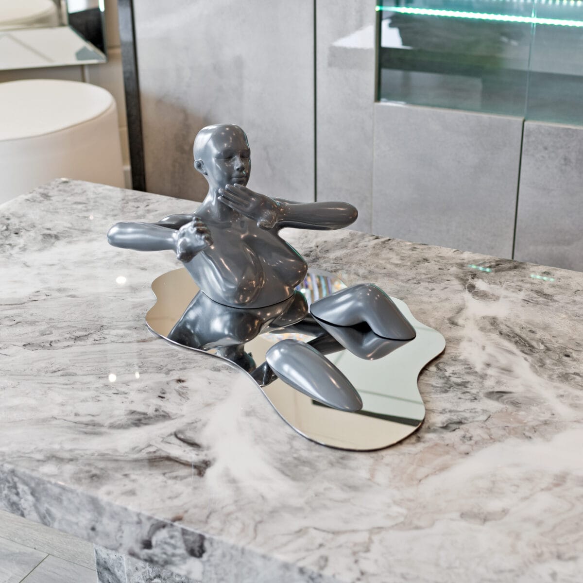 Liquid Embrace Grey Resin Sculpture on Display