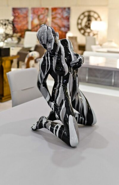 Kneeling Black and Grey Yoga Lady Sculpture in our Showroom