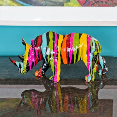 paint dripped black rhino sculpture