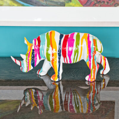 paint dripped white rhino sculpture