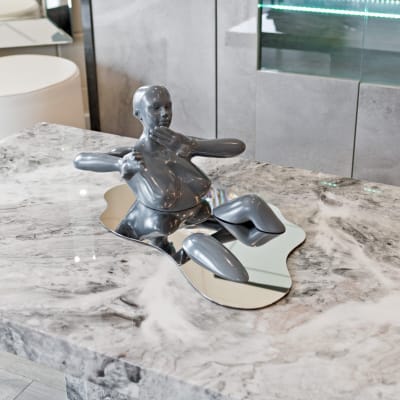 Liquid Embrace Grey Resin Sculpture on Display